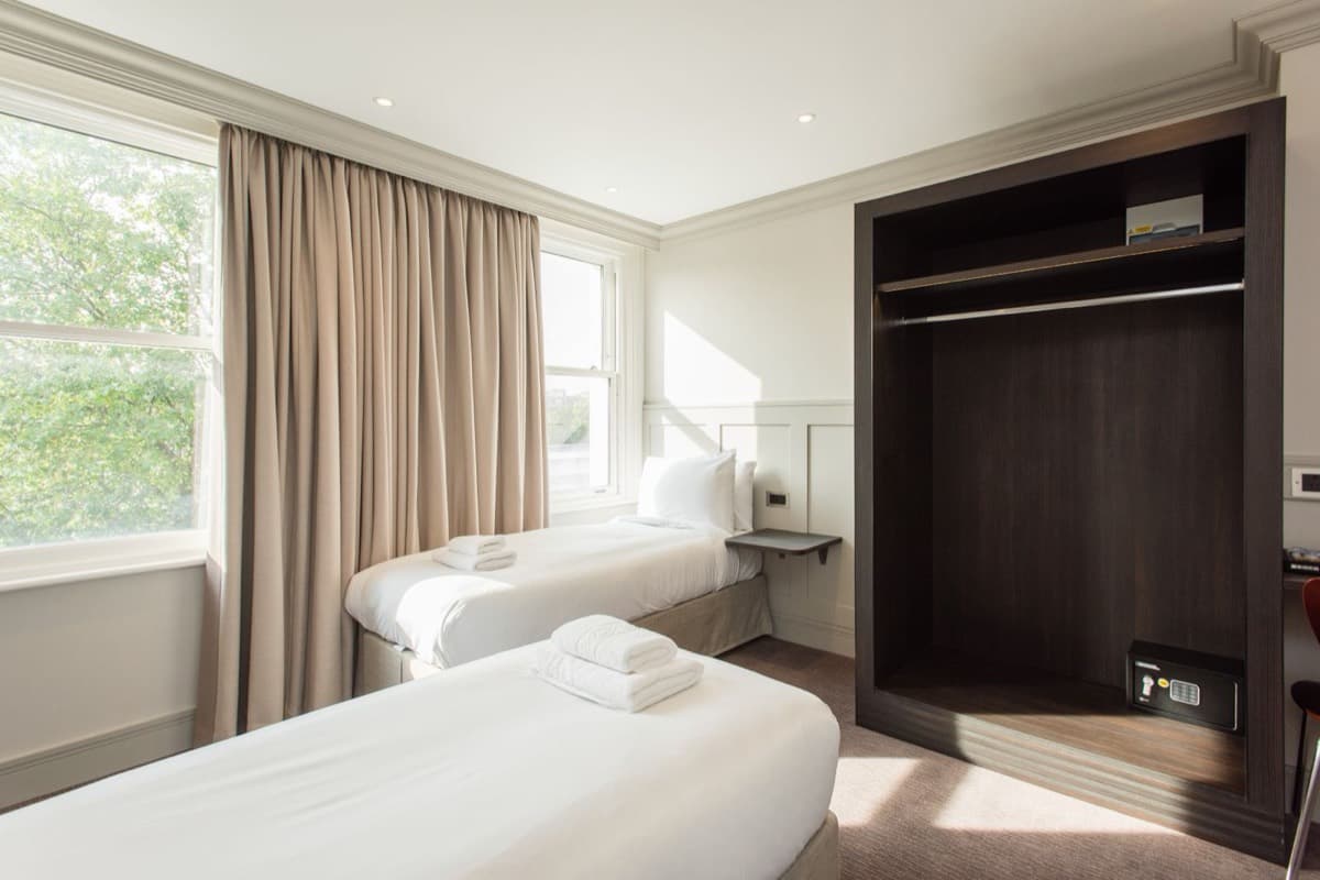 Hotel-standard styled bedroom in a guest-ready serviced apartment