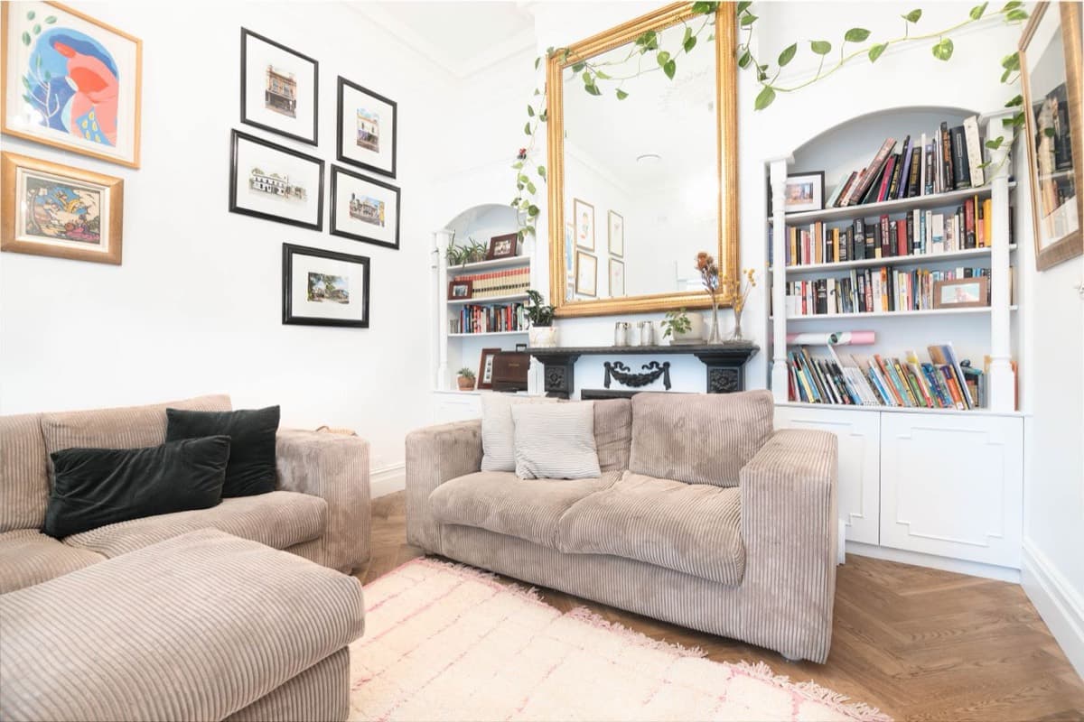 Furnished, lived-in London residential living room with sofas, soft furnishings and an open-plan kitchen, prepared to a guest-ready standard by Urban Ready